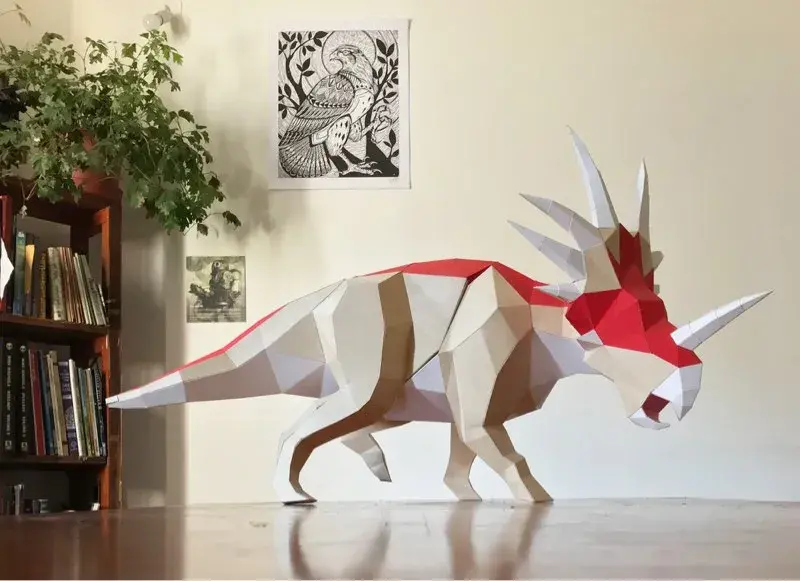 Art papier dinosaure blanc et rouge profil